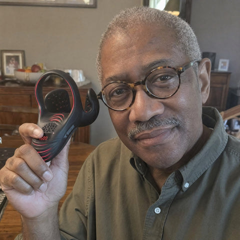 VasoCore customer holding the device